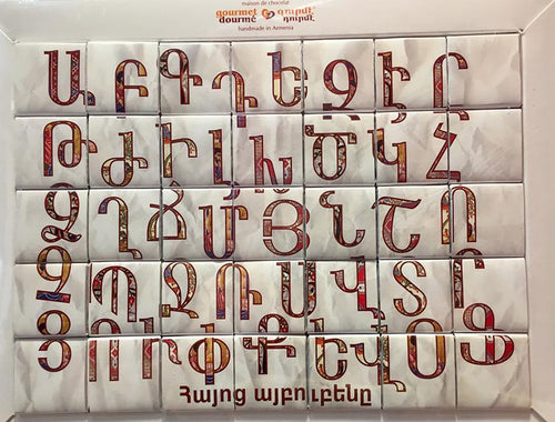 Handmade milk & dark chocolates forming the Armenian alphabet puzzle